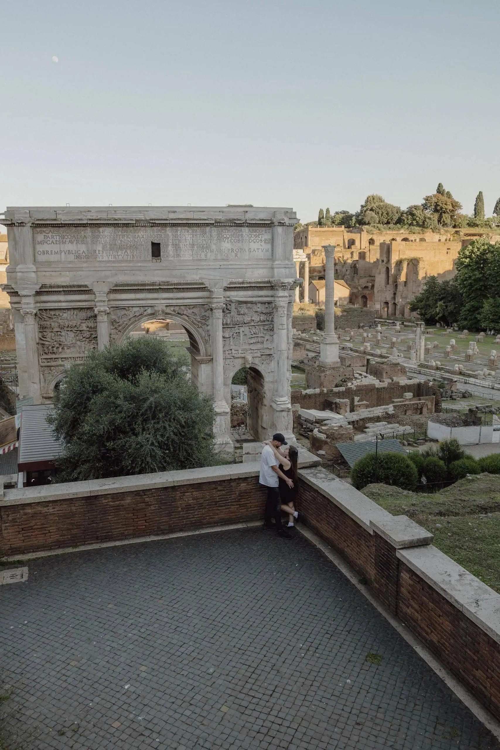 Couple embracing arch of septimius roman forum Rome - Rome by Finzi