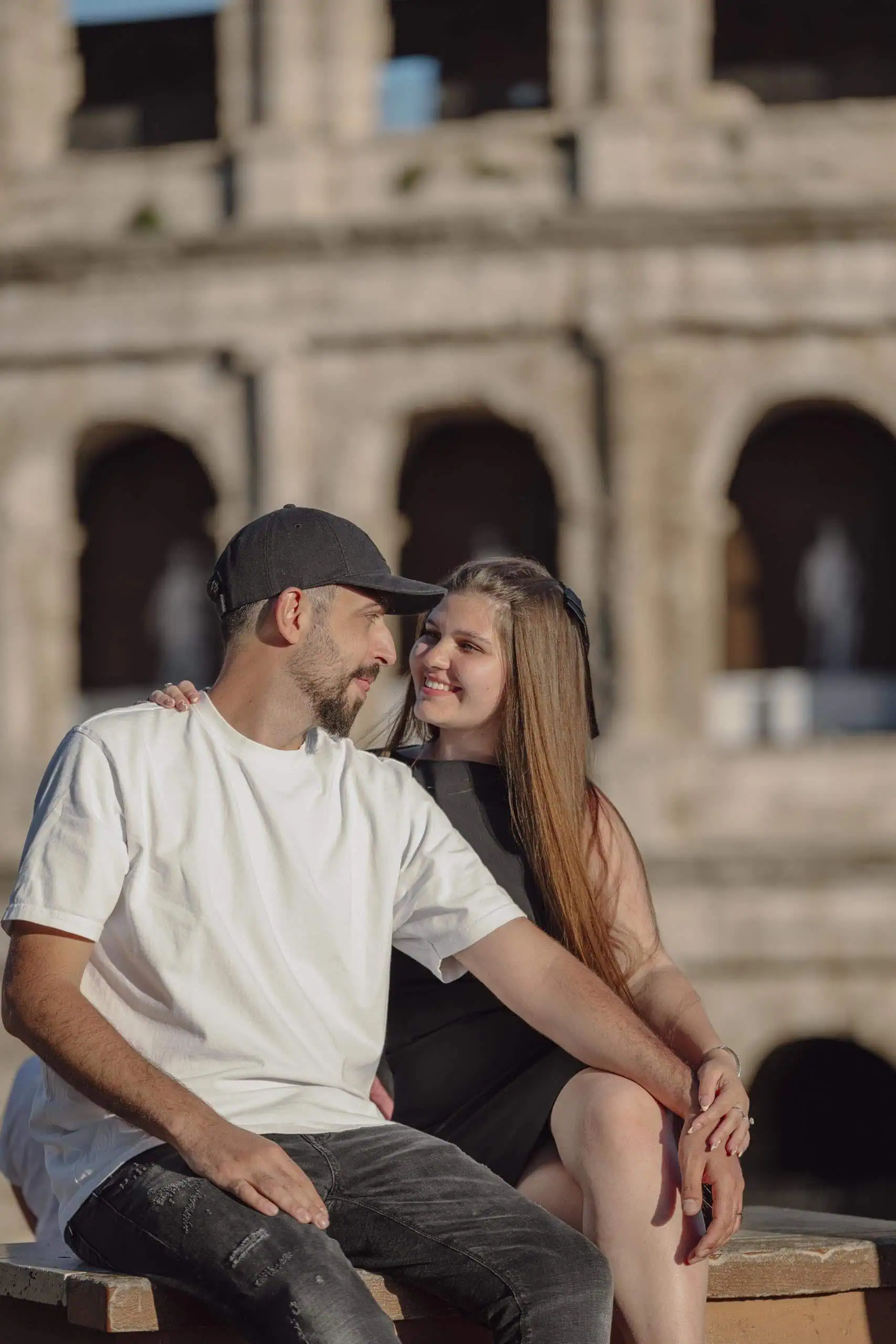 Couple embracing seated colosseum Rome - Rome by Finzi
