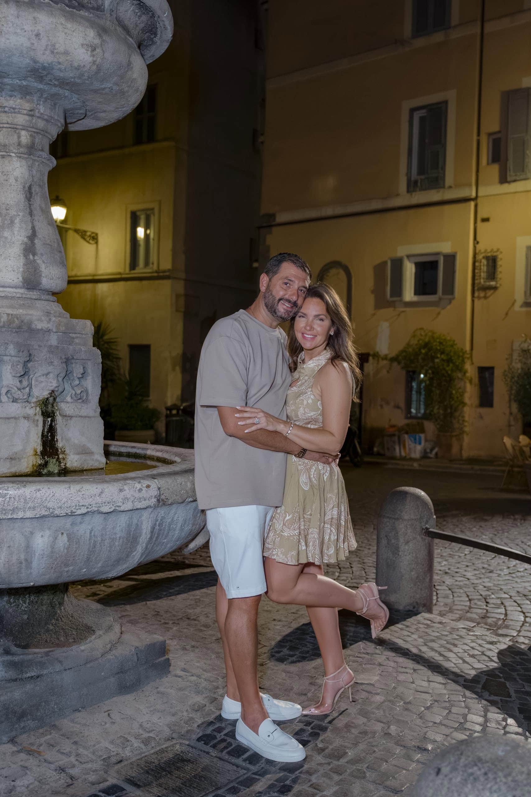 Couple posing stone fountain night Rome - couples photography in Rome by Finzi