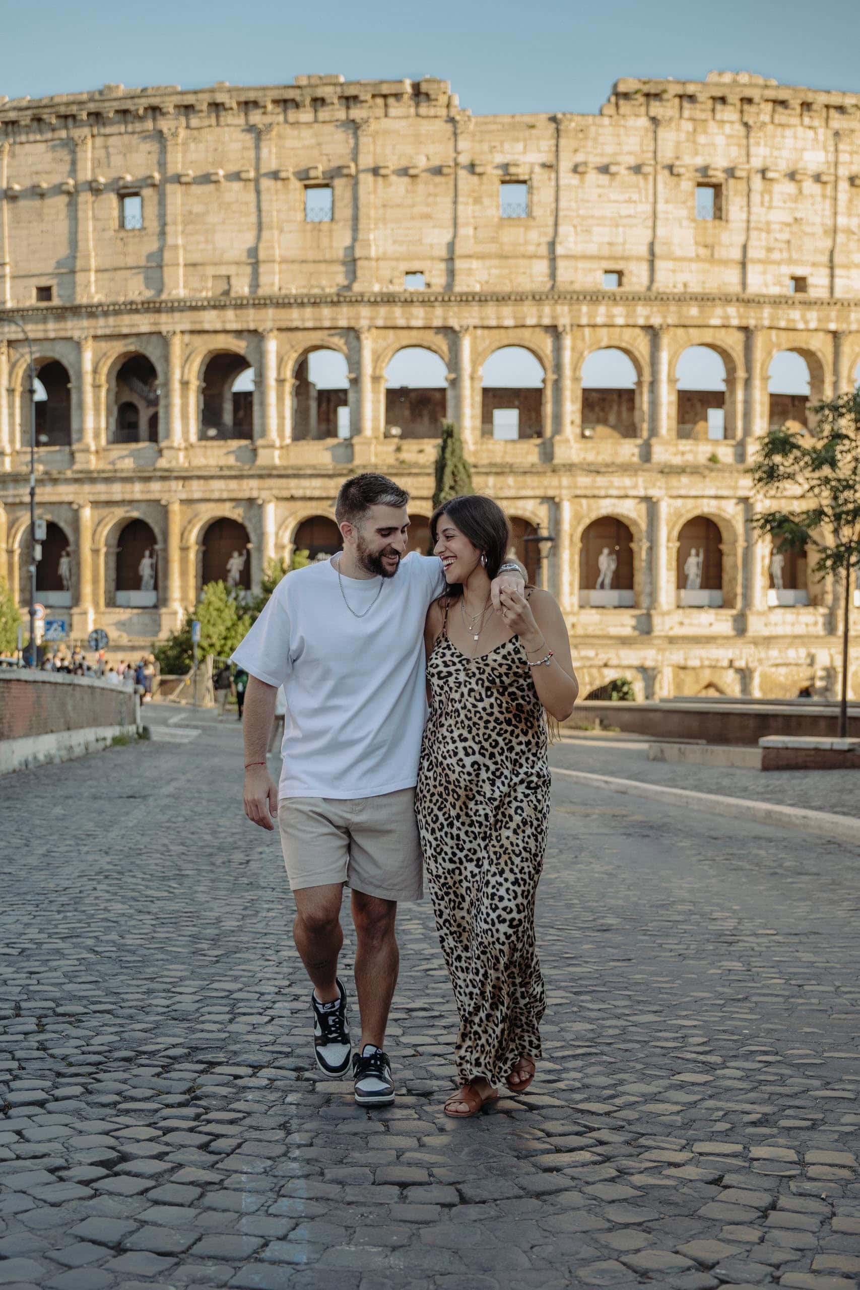 Couple walking colosseum Rome - couples photography in Rome by Finzi