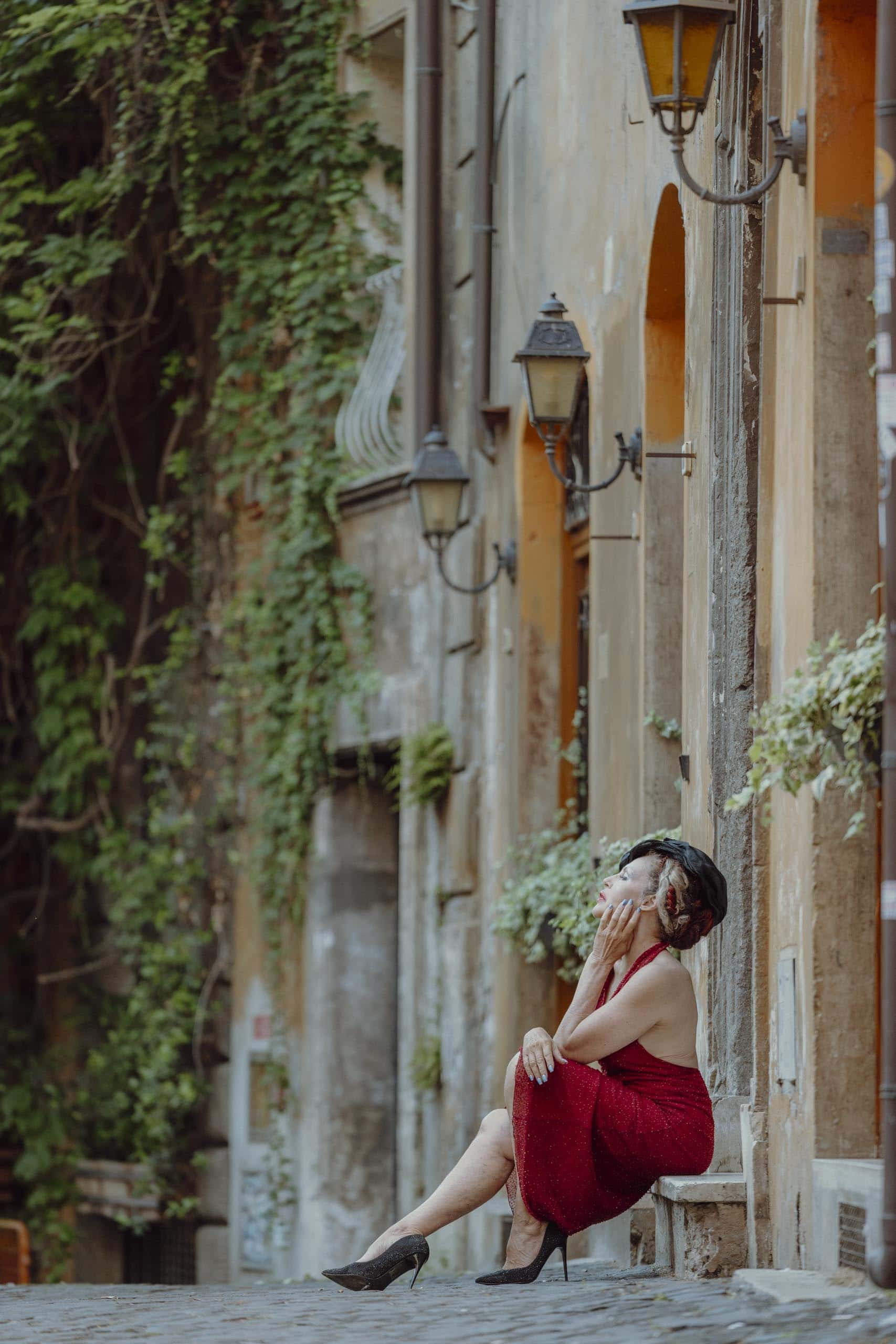 Woman red dress street portrait Rome - solo photography in Rome by Finzi